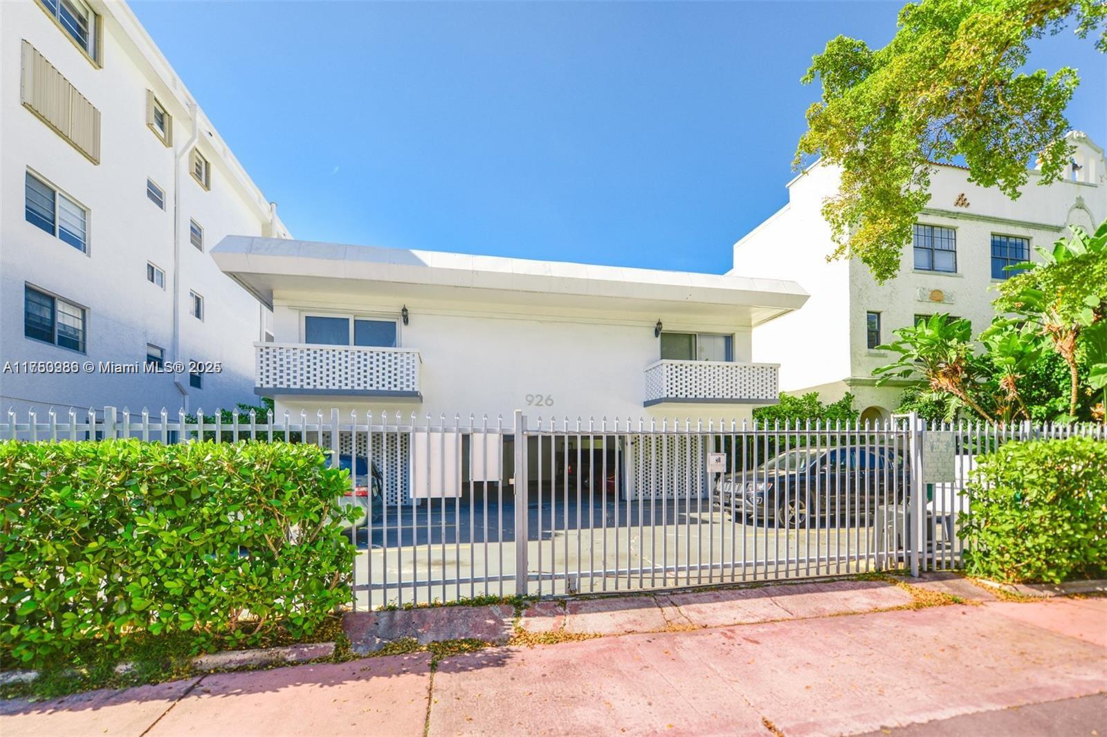 926 Michigan Avenue, Unit 12 Miami Beach, FL 33139 - Photo 13 of 14 a front view of a house with a garden
