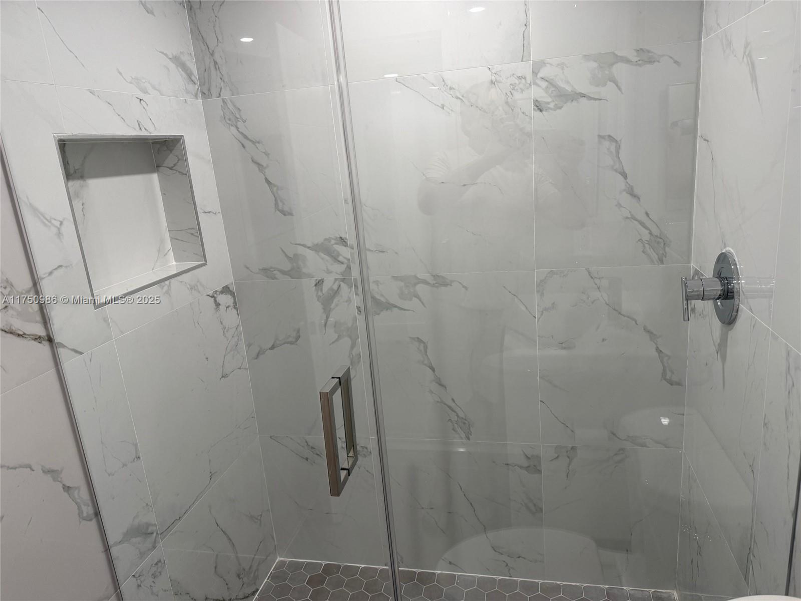 926 Michigan Avenue, Unit 12 Miami Beach, FL 33139 - Photo 10 of 14 a bathroom with a shower