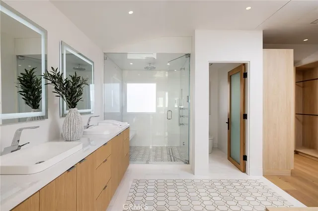 a bathroom with a tub sink and mirror