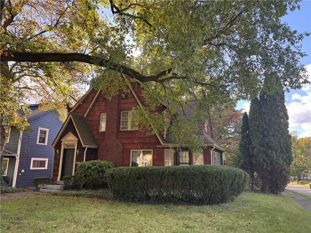 a front view of a house with garden