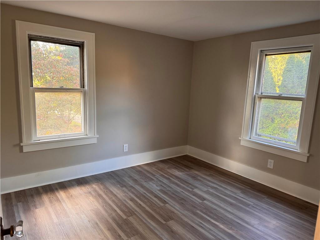 329 Norris Street Sharon, PA 16146 - Photo 15 of 19 a view of an empty room with wooden floor and a window