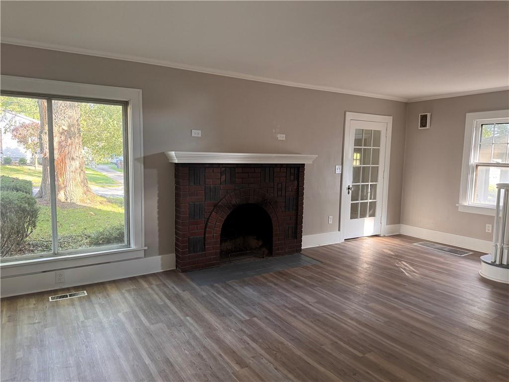 329 Norris Street Sharon, PA 16146 - Photo 5 of 19 wooden floor fireplace and windows in an empty room