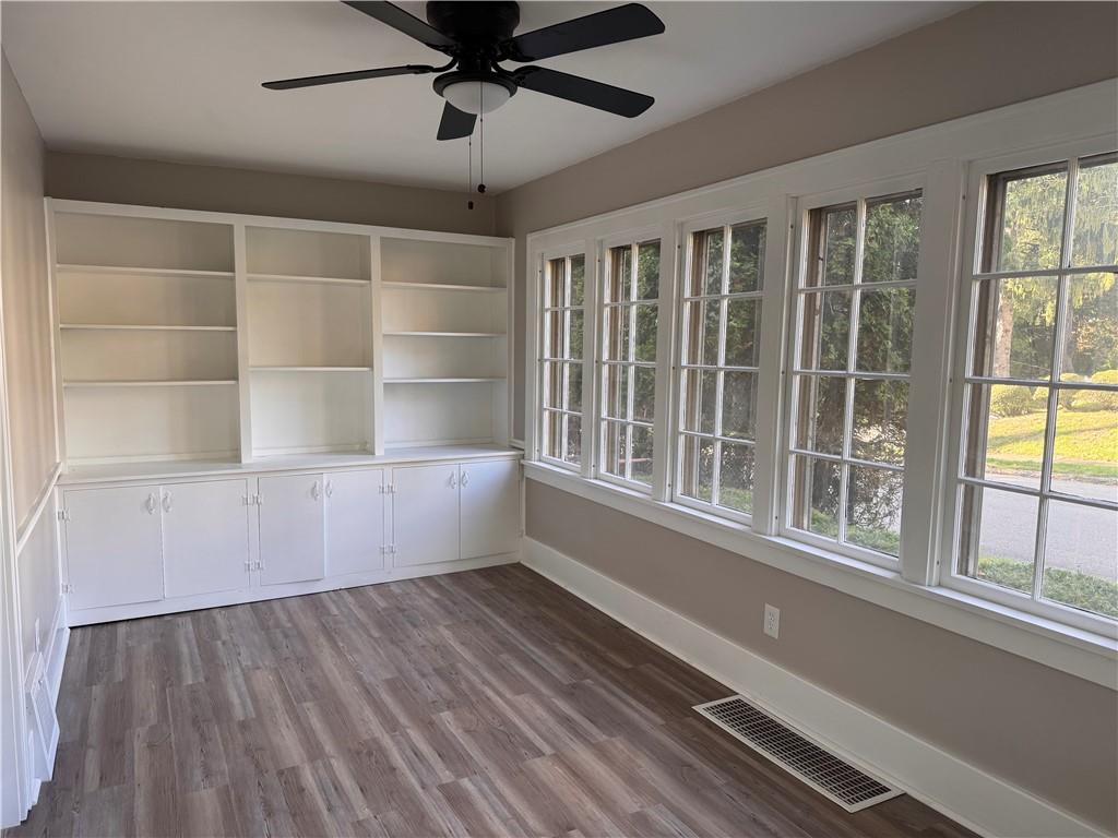 329 Norris Street Sharon, PA 16146 - Photo 6 of 19 a view of an empty room with a window and wooden floor