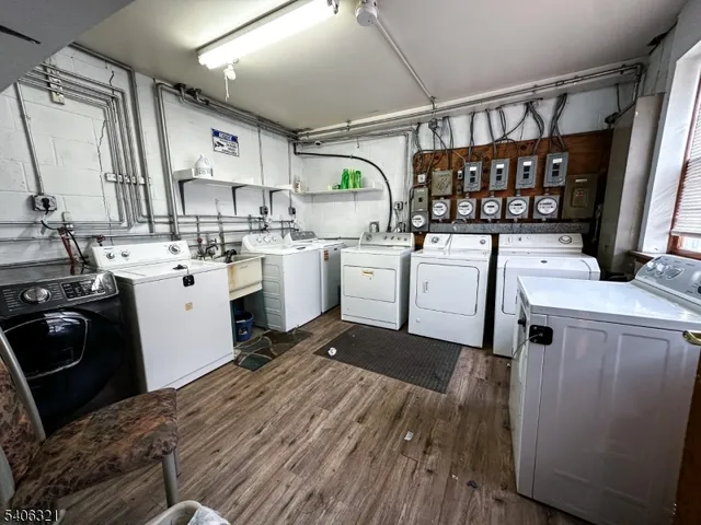 a kitchen with sink a stove and cabinets