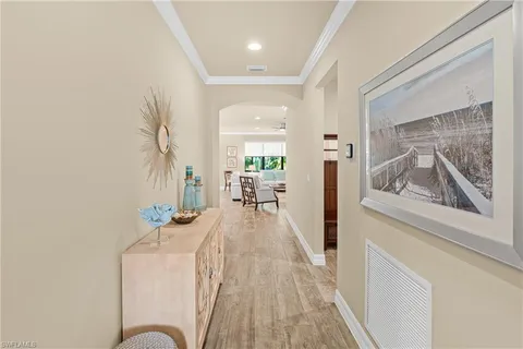 a view of living room filled with furniture and wooden floor