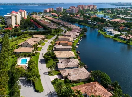 an aerial view of a house with outdoor space and lake view