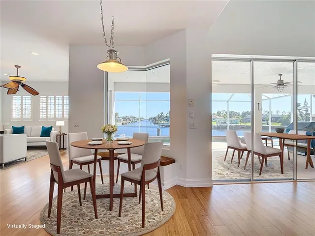 a spacious bedroom with a bed and a flat screen tv