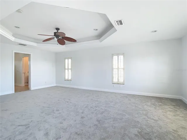 a large bathroom with a sink and a mirror