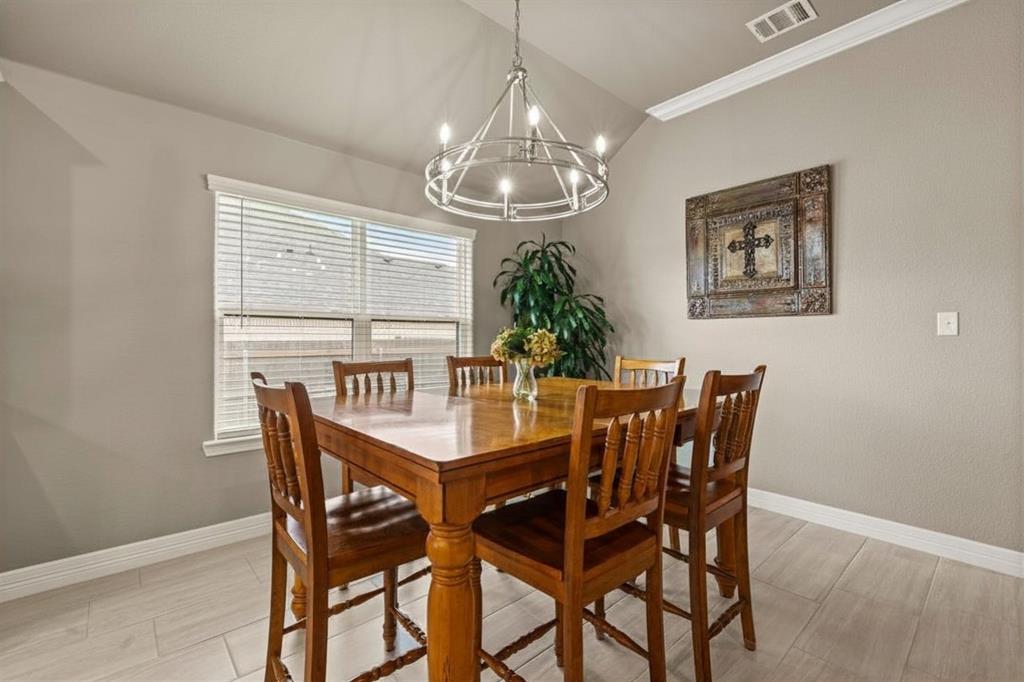 828 Agile Street Hewitt, TX 76643 - Photo 9 of 30 a view of a dining room with furniture window and outside view