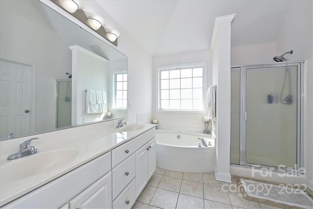3708 Zebulon Williams Road Monroe, NC 28110 - Photo 25 of 48 a bathroom with a bathtub shower and a sink