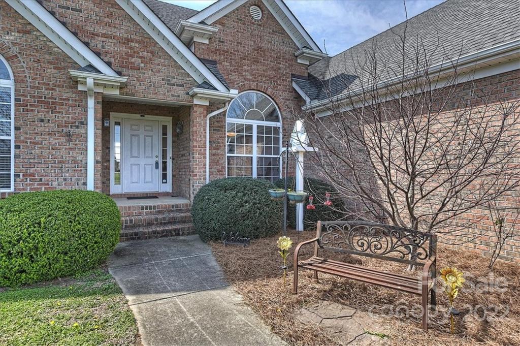 3708 Zebulon Williams Road Monroe, NC 28110 - Photo 4 of 48 a front view of a house with a garden
