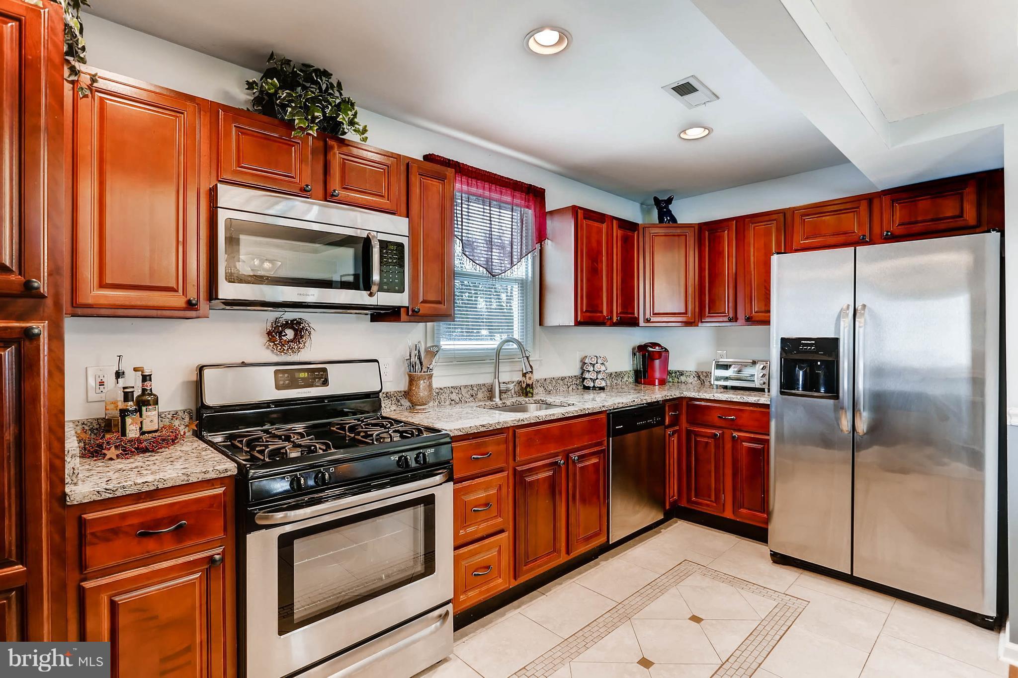 8645 Oakleigh Road Baltimore, MD 21234 - Photo 9 of 28 SS Appliances, granite countertops, ceramic tile