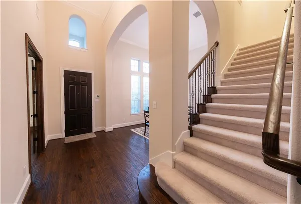 a view of entryway with wooden floor
