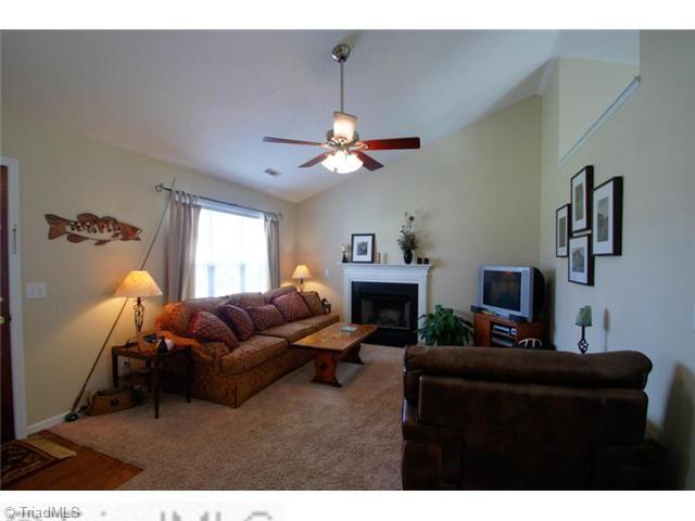5091 Windsbury Ridge Road Clemmons, NC 27012 - Photo 2 of 12 Living Room. Entertain guests in this lovely space with bright natural light, a soaring ceiling and a cozy fireplace.