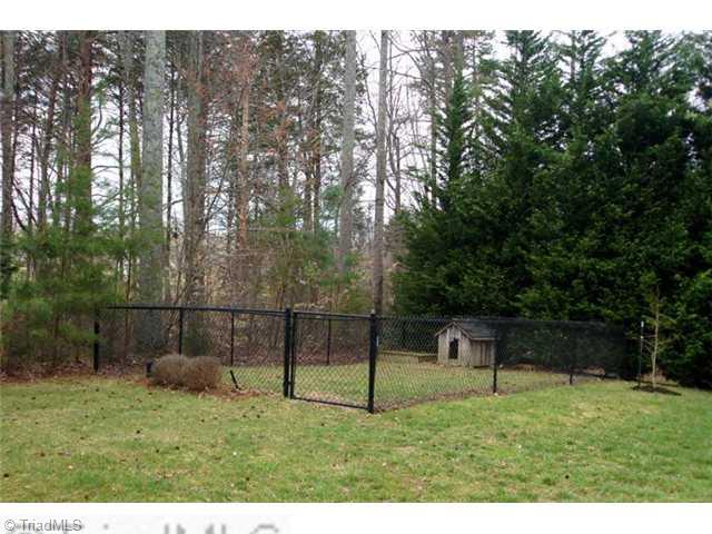 5091 Windsbury Ridge Road Clemmons, NC 27012 - Photo 12 of 12 Yard/Garden. Surrounded by shade, this backyard has room to roam for children and/or pets.
