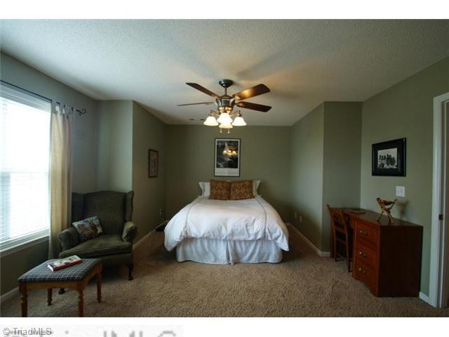 5091 Windsbury Ridge Road Clemmons, NC 27012 - Photo 6 of 12 Master Bedroom. Enjoy this spacious master "retreat" as you unwind from your busy day. A huge walk-in closet will organize all of your belongings and adds to the peaceful feeling of this master suite.