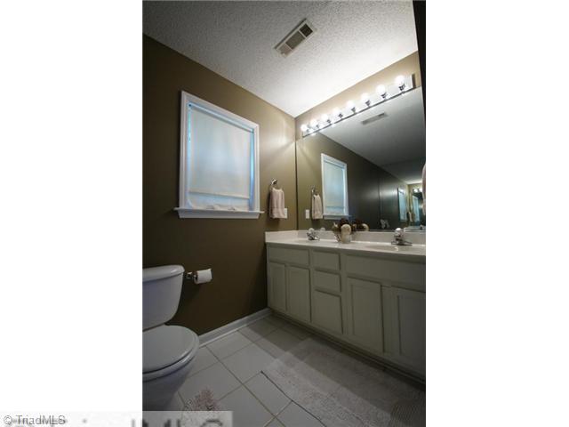 5091 Windsbury Ridge Road Clemmons, NC 27012 - Photo 7 of 12 Master Bath/Spa. This master bath is highlighted by dual sinks and a calming decor.