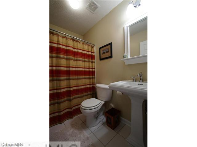 5091 Windsbury Ridge Road Clemmons, NC 27012 - Photo 10 of 12 Other. This neutral hall bath has been updated and has tile flooring.
