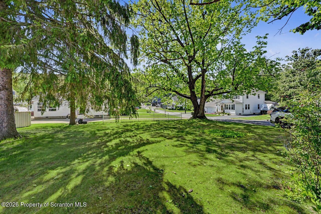 502 Layton Road Clarks Summit, PA 18411 - Photo 40 of 42 a green field with lots of trees
