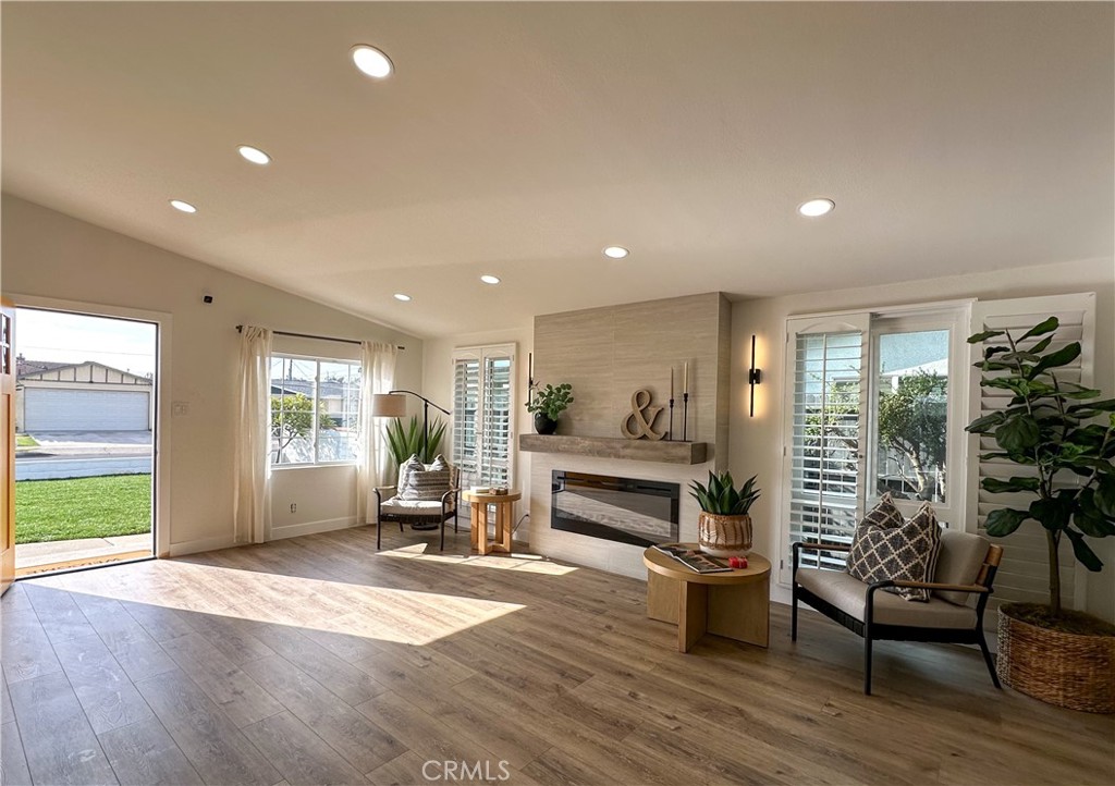 2749 East Everett Place Orange, CA 92867 - Photo 11 of 52 a living room with furniture floor to ceiling window and wooden floor