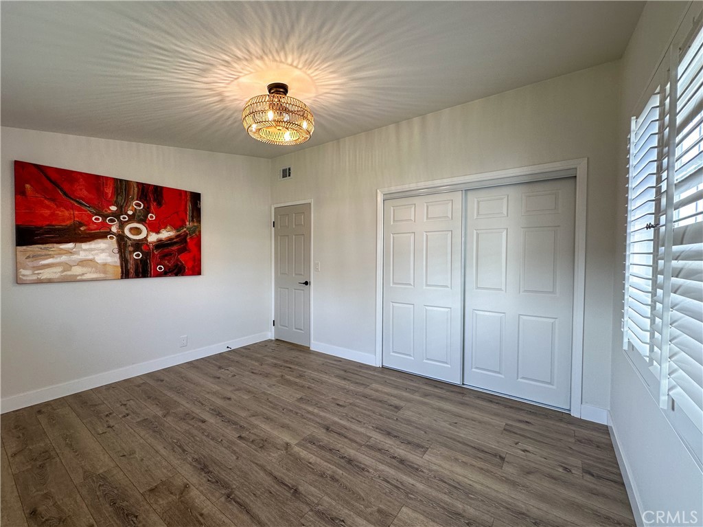 2749 East Everett Place Orange, CA 92867 - Photo 30 of 52 wooden floor in an empty room with a window