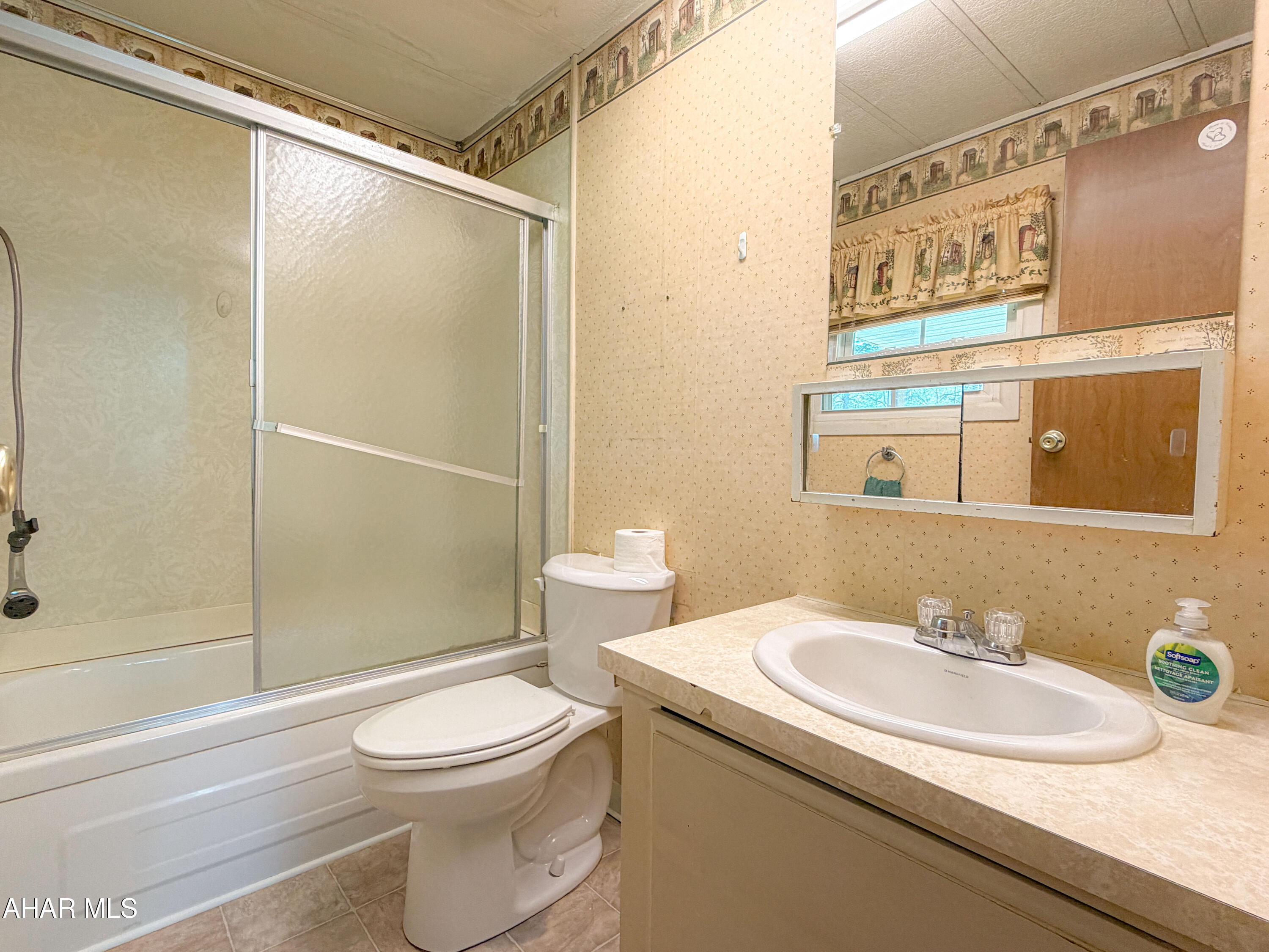 151 Pine Echo Road Everett, PA 15537 - Photo 39 of 51 a bathroom with a sink a toilet and shower
