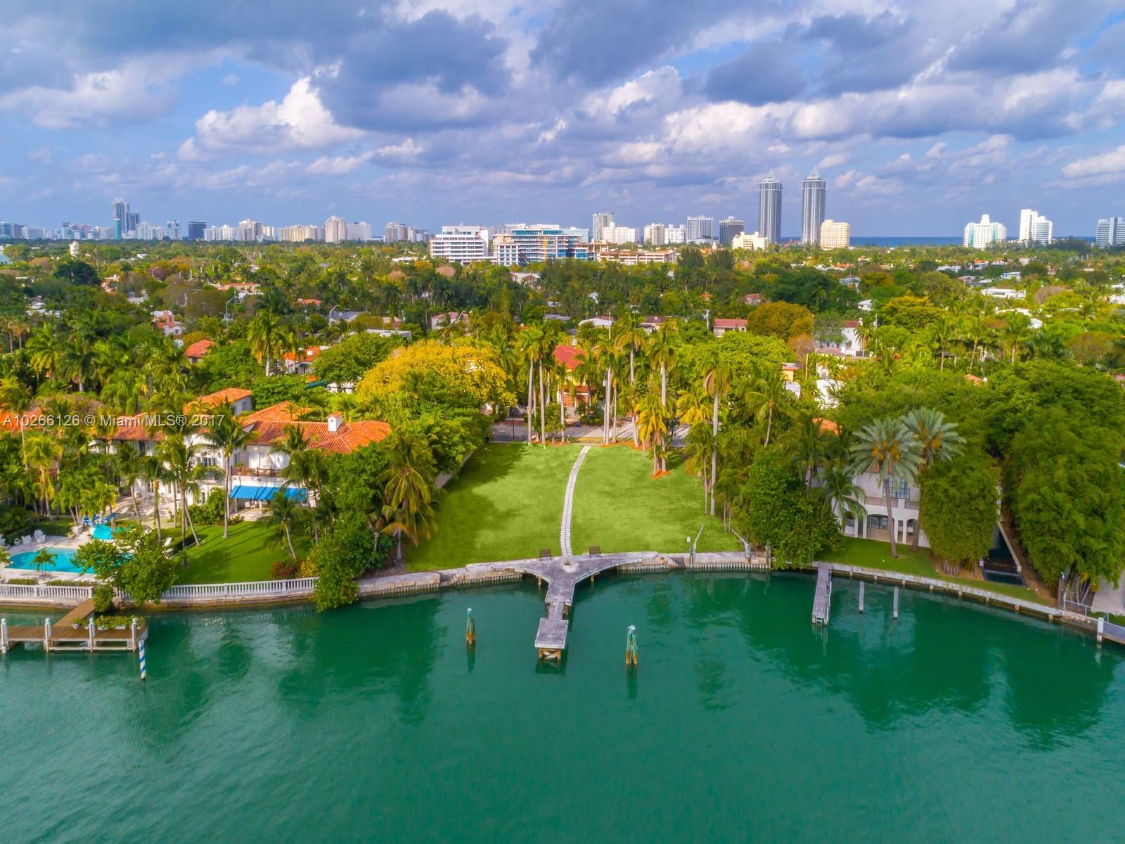 4462 North Bay Road Miami Beach, FL 33140 - Photo 3 of 6 a view of a lake with houses