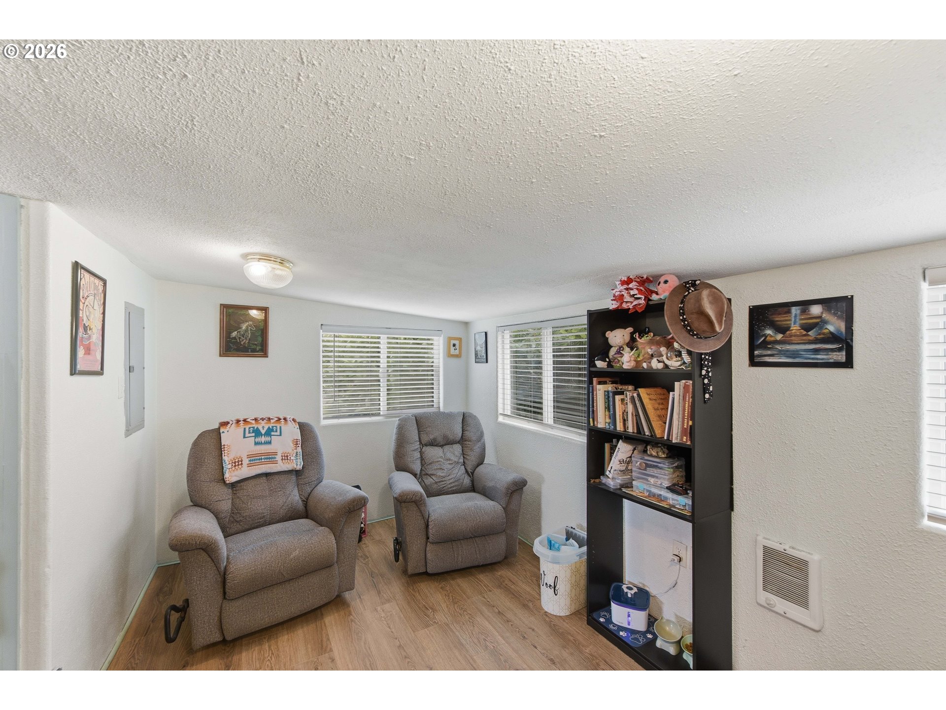 1955 Maple Street North Bend, OR 97459 - Photo 24 of 48 a living room with furniture and a flat screen tv