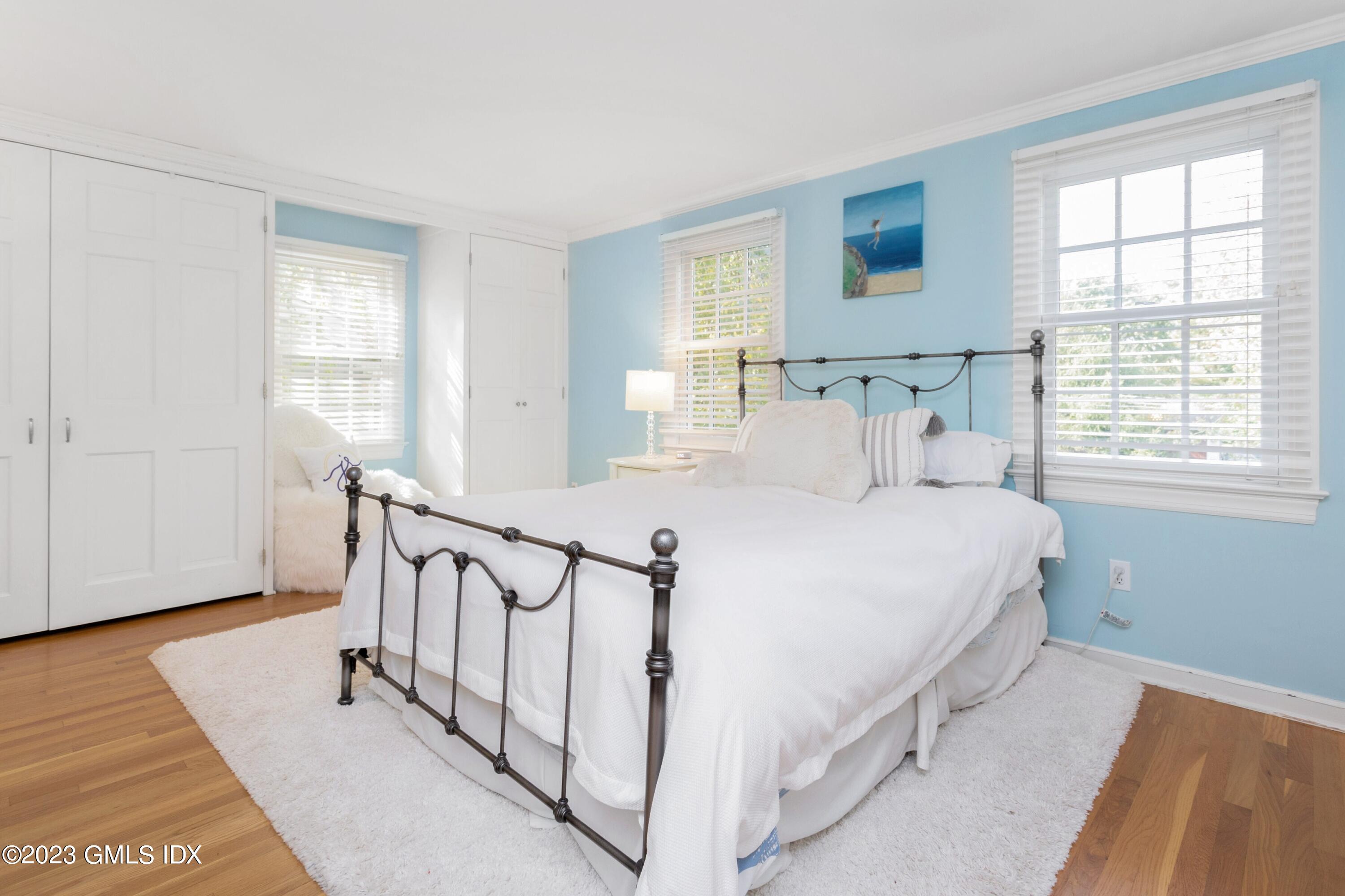 7 Colonial Lane Riverside, CT 06878 - Photo 16 of 27 a bed room with a bed and a window