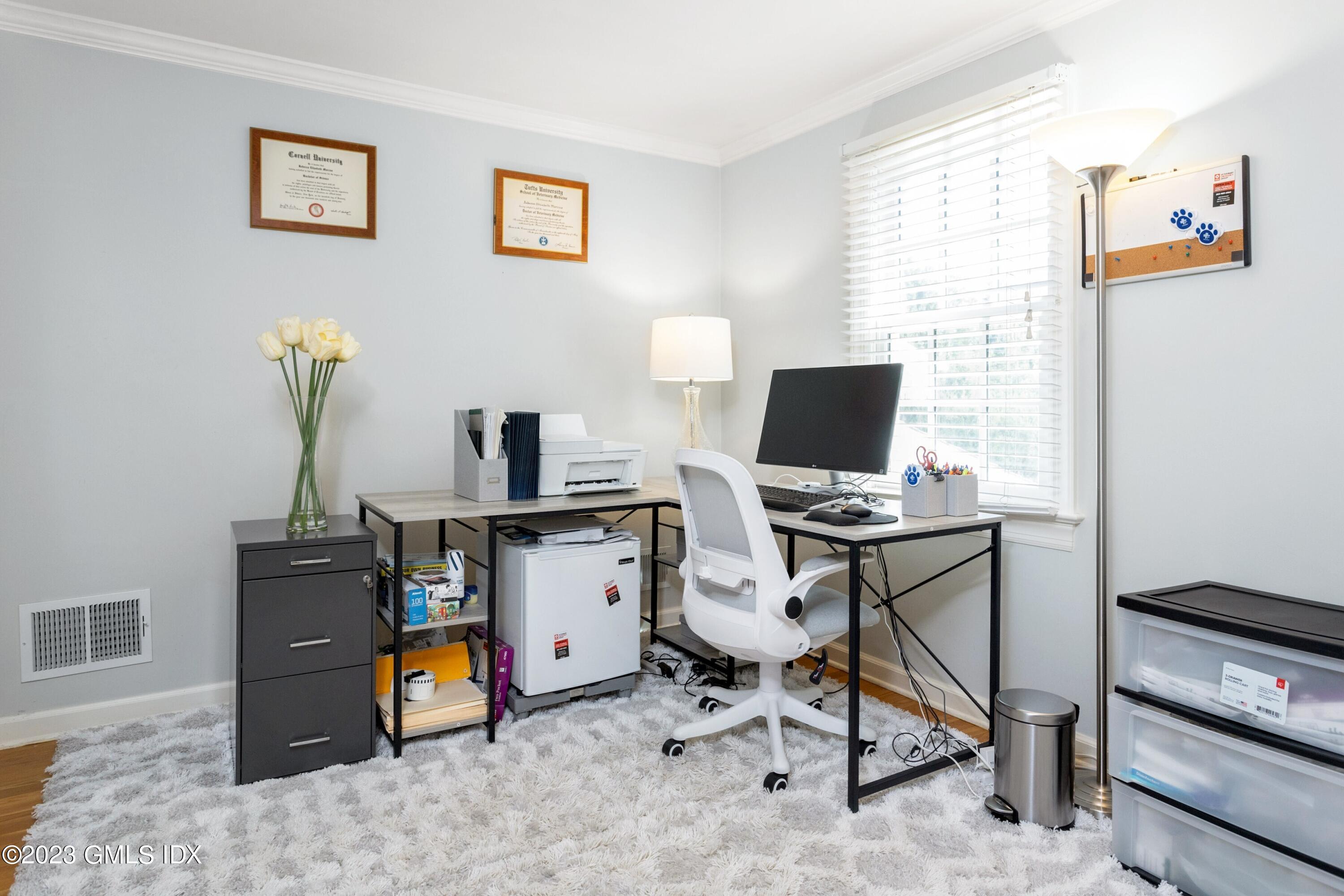 7 Colonial Lane Riverside, CT 06878 - Photo 18 of 27 a view of a workspace with furniture and a window