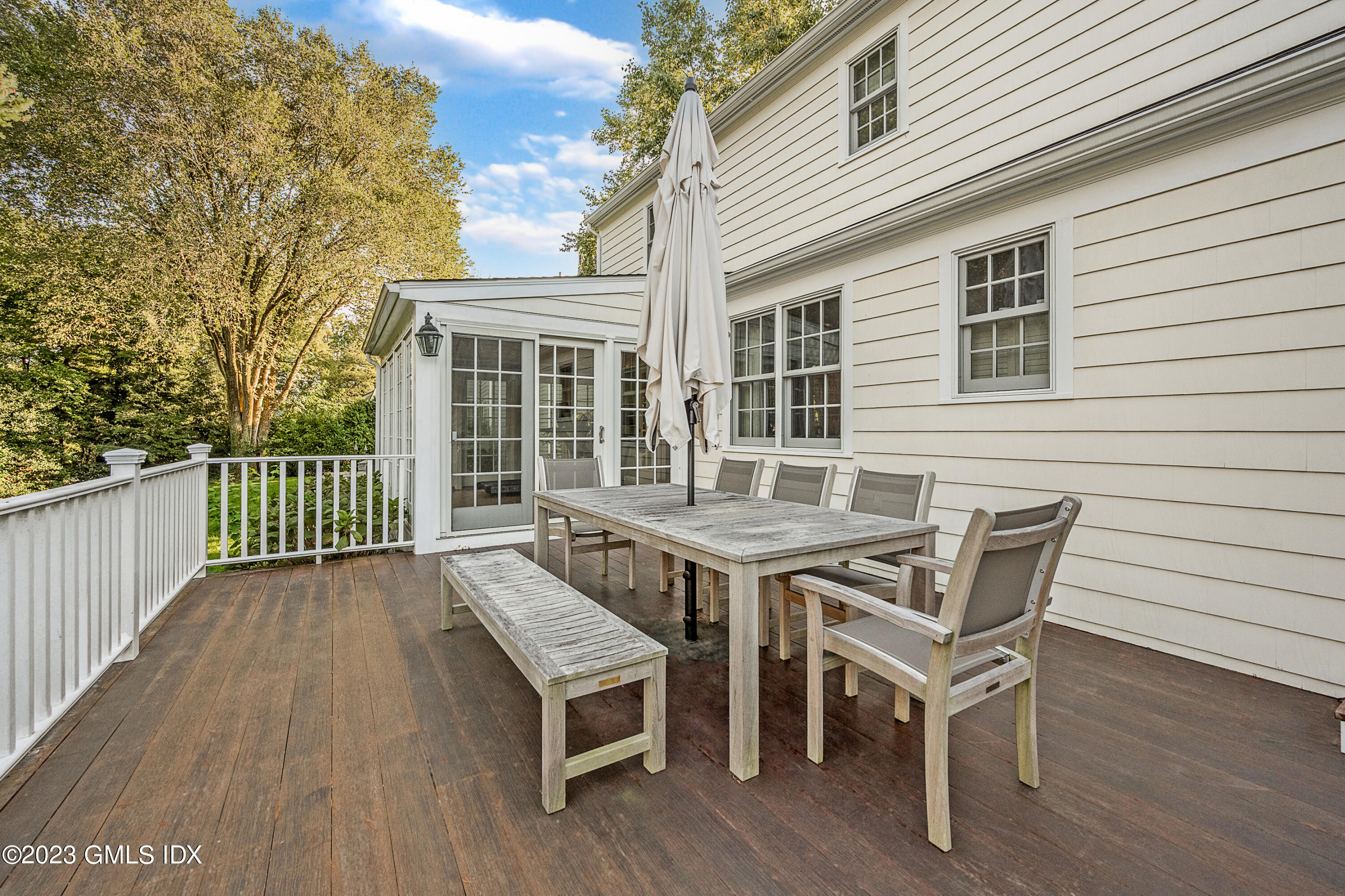 7 Colonial Lane Riverside, CT 06878 - Photo 20 of 27 a view of a wooden chairs on the deck
