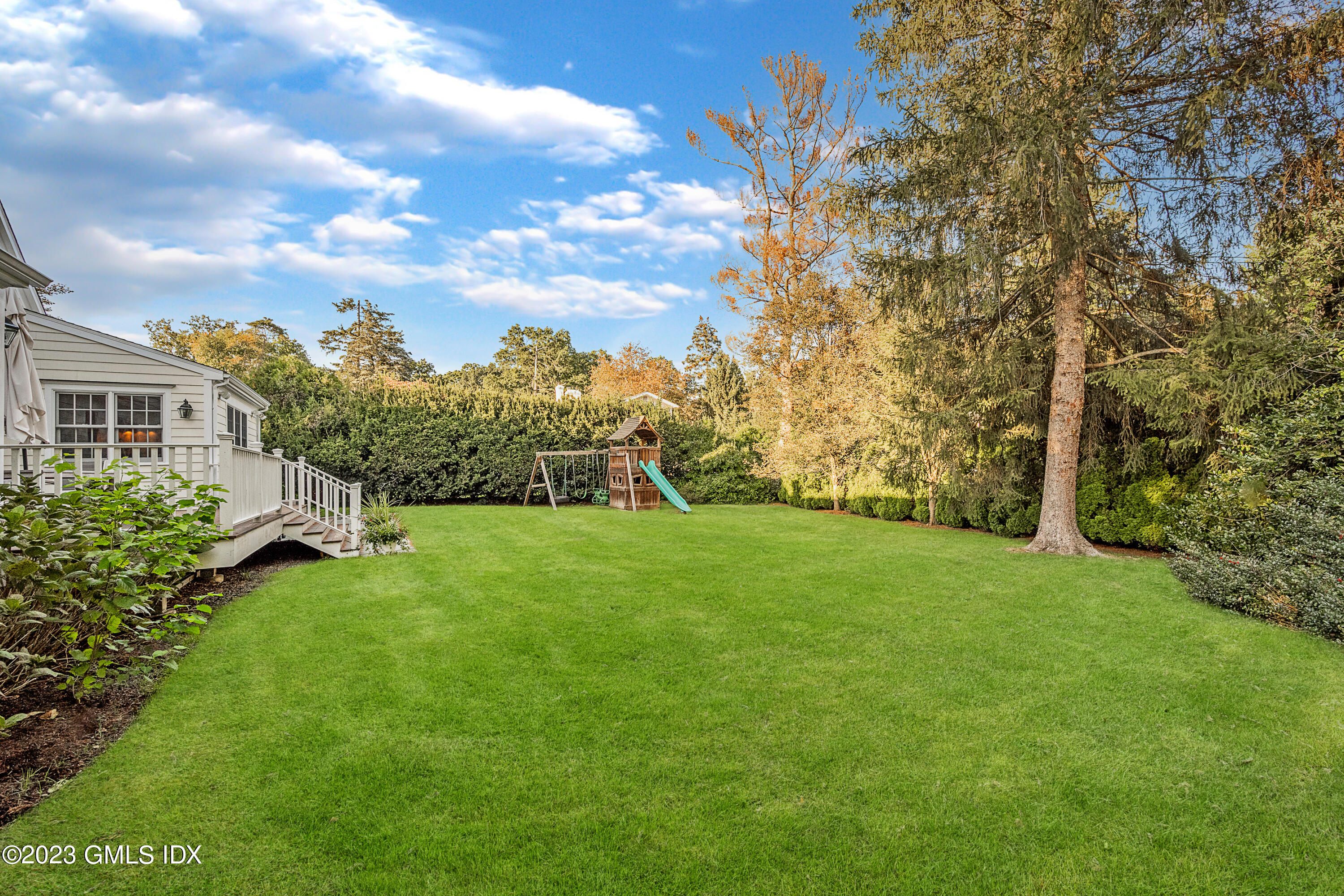 7 Colonial Lane Riverside, CT 06878 - Photo 24 of 27 a view of a big yard with plants and large trees