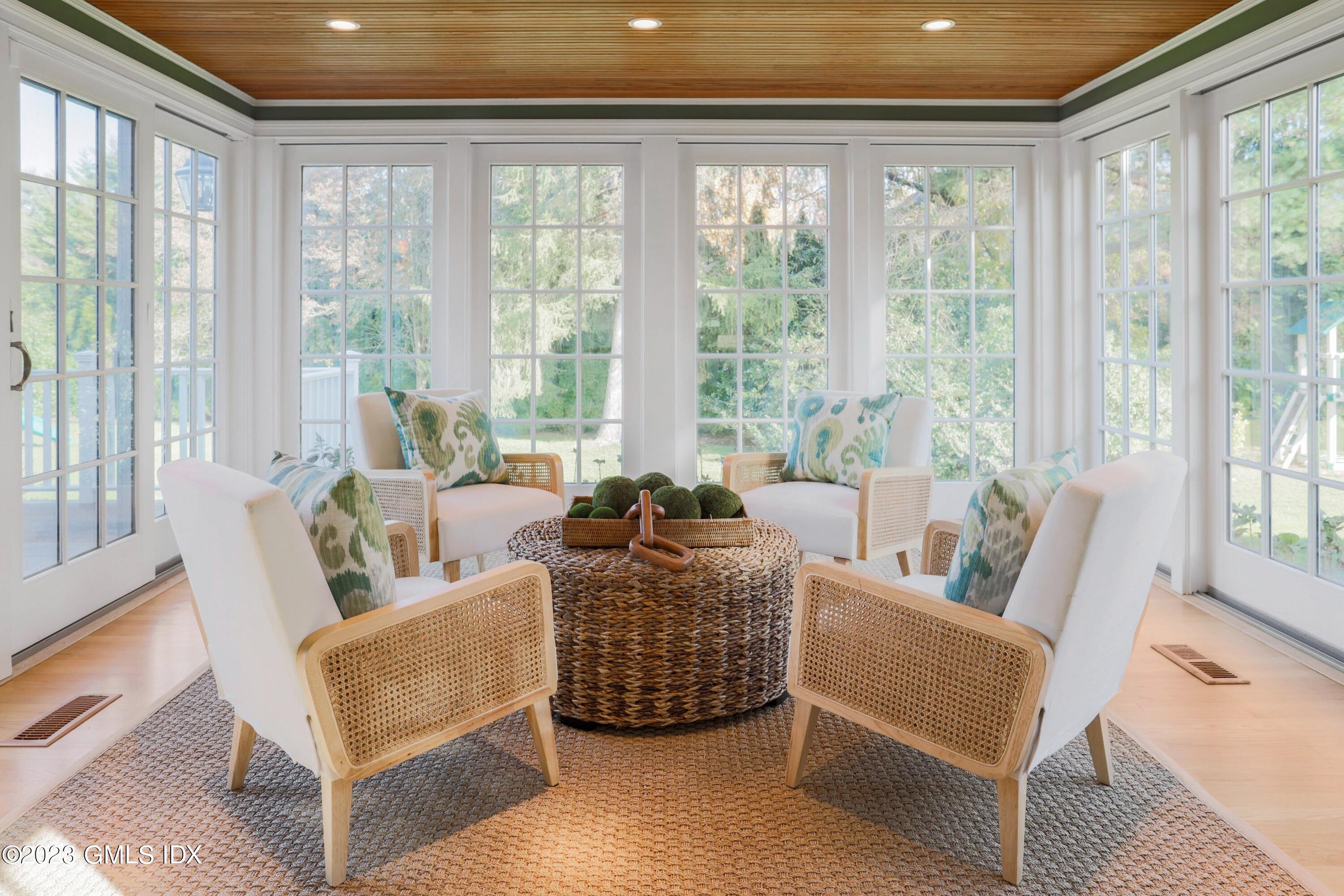 7 Colonial Lane Riverside, CT 06878 - Photo 8 of 27 a living room with furniture and a large window