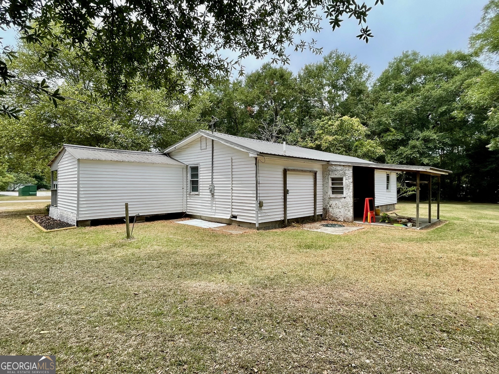623 Virginia Avenue Millen, GA 30442 - Photo 2 of 34 a house with trees in the background