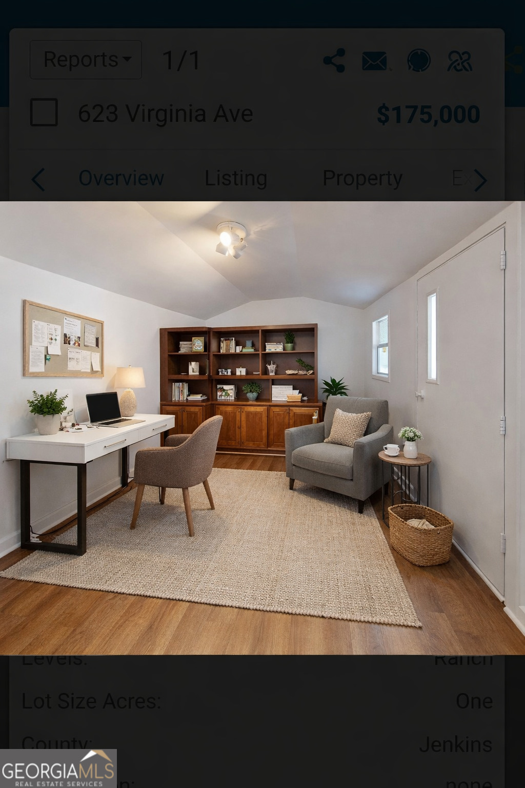 623 Virginia Avenue Millen, GA 30442 - Photo 25 of 34 a living room with furniture and a rug