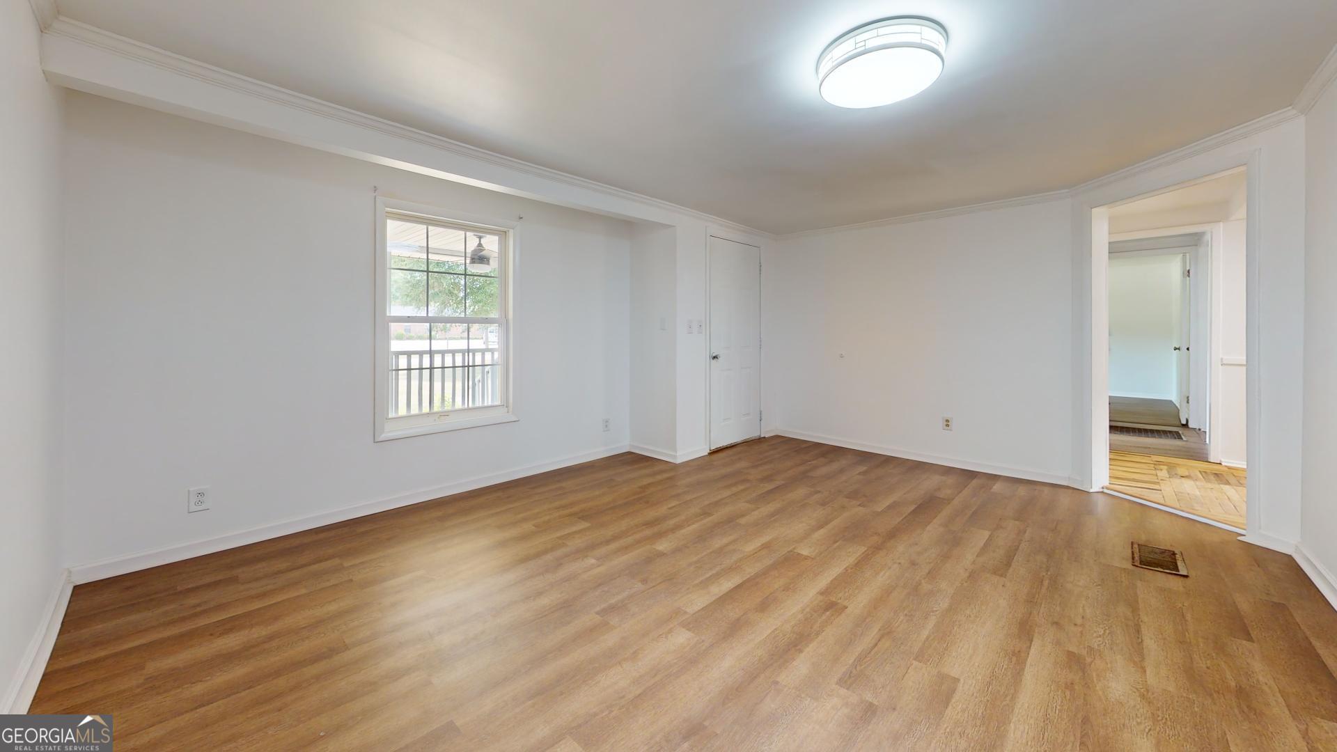 623 Virginia Avenue Millen, GA 30442 - Photo 27 of 34 a view of empty room with wooden floor