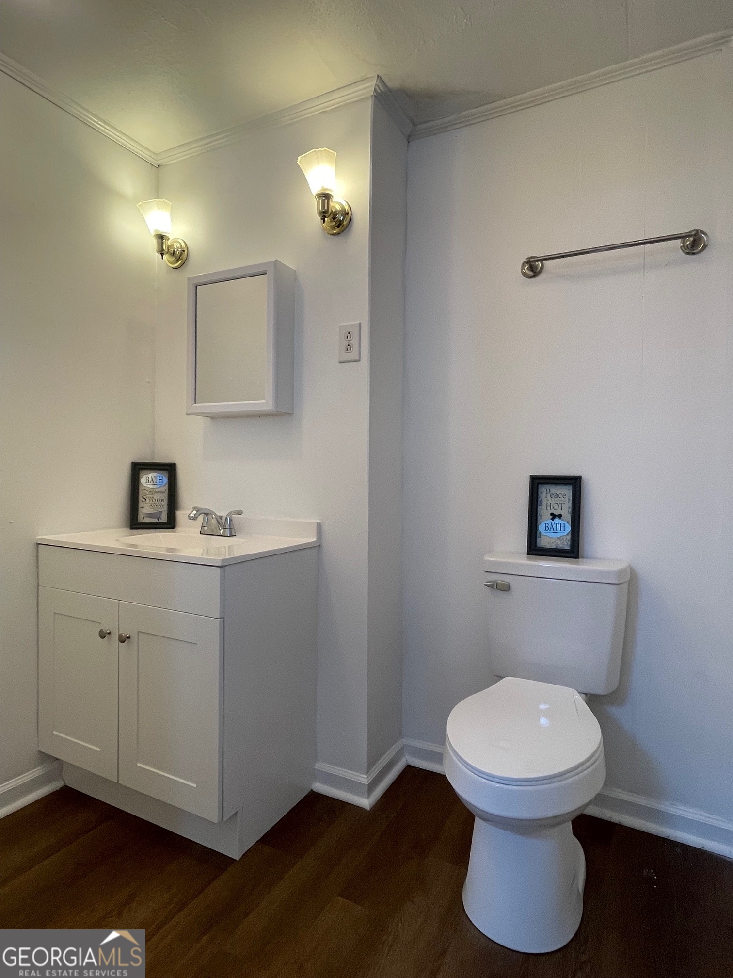 623 Virginia Avenue Millen, GA 30442 - Photo 28 of 34 a bathroom with a toilet a sink and mirror