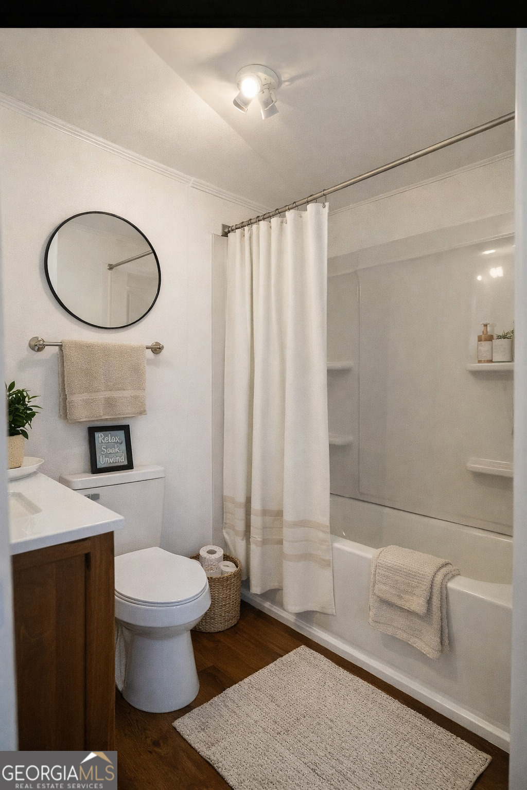 623 Virginia Avenue Millen, GA 30442 - Photo 29 of 34 a bathroom with a sink a toilet and a mirror