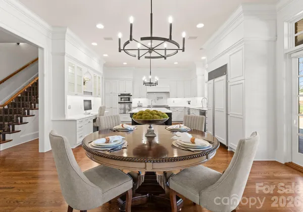 a view of a dining room with furniture and wooden floor