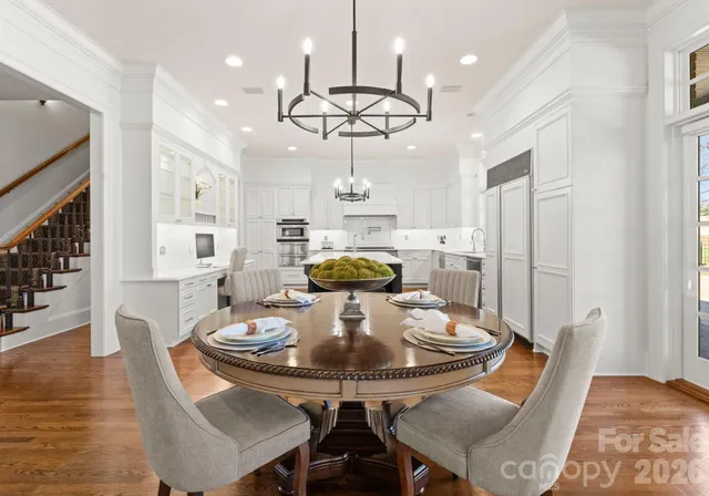 a view of a dining room with furniture and wooden floor