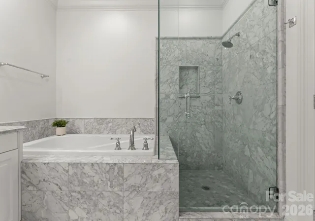 a bathroom with a shower and a sink