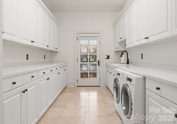 a view of a kitchen with washer and dryer