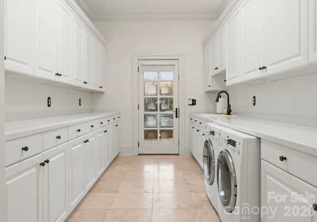 a view of a kitchen with washer and dryer