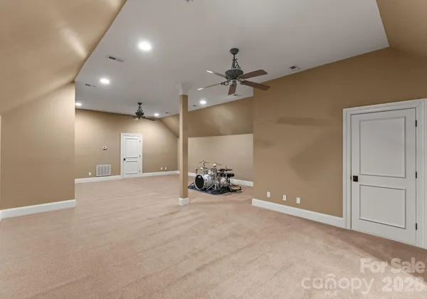 a view of a room with projector and furniture