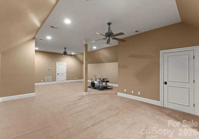 a view of a room with projector and furniture