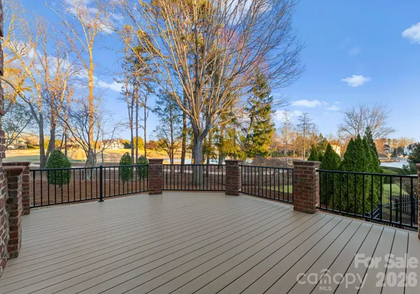 a view of a balcony with wooden fence