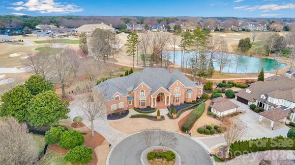 an aerial view of a house with outdoor space