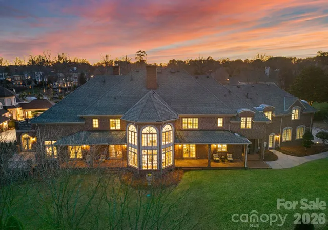 an aerial view of house with yard and entertaining space