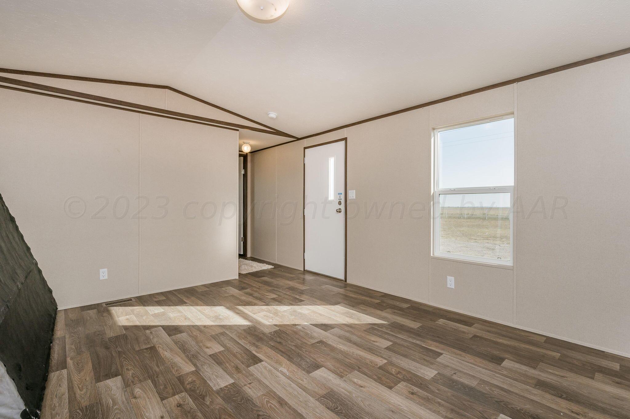 8300 South Blessen Road Amarillo, TX 79119 - Photo 7 of 32 Living Room-2