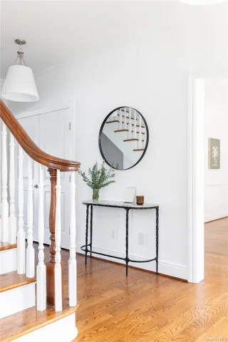 a view of an entryway with wooden floor